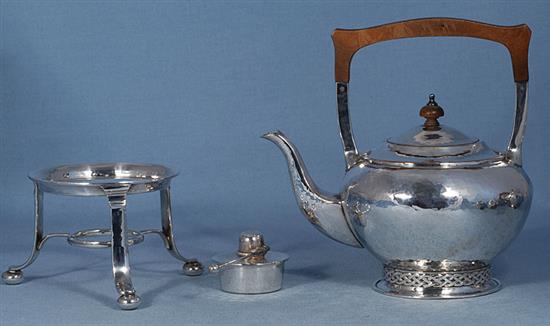 A Georged V silver Arts & Crafts three piece tea set,